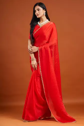 Red color fendy chiffon saree with running blouse