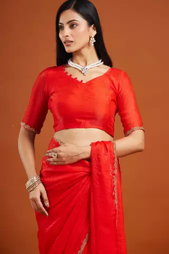 Red color fendy chiffon saree with running blouse