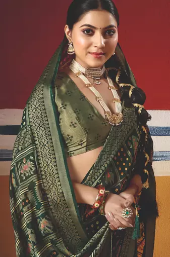dark green brasso border work saree