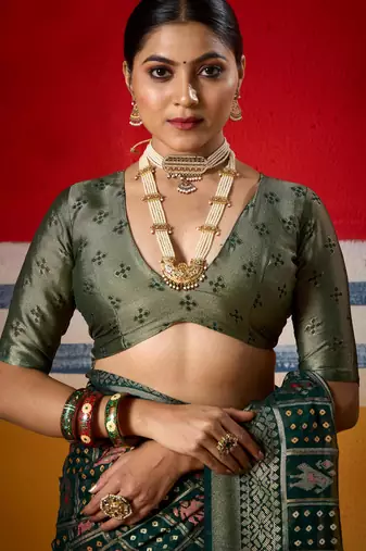 dark green brasso border work saree