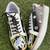 Black mirror embroidered leather sneaker