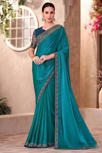 Peacock blue satin georgette saree with linen work blouse