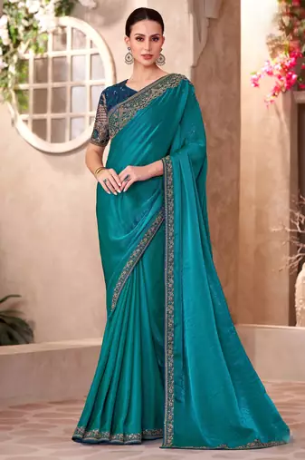 Peacock blue satin georgette saree with linen work blouse