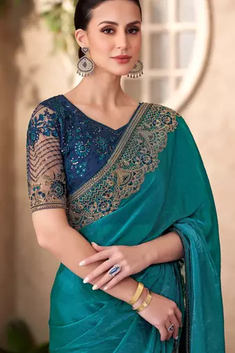 Peacock blue satin georgette saree with linen work blouse