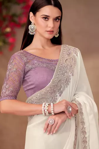Pearl white shining georgette saree with linen work blouse