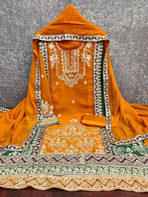  yellow heavy embroidery & fancy border georgette dress material 2