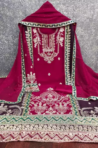 magenta heavy embroidery & fancy border georgette dress material