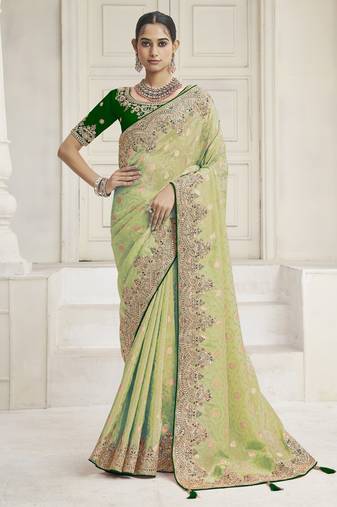 Pista green color handwork and zari-cord tissue viscose saree with designer blouse fabric