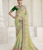 Pista green color handwork and zari-cord tissue viscose saree with designer blouse fabric