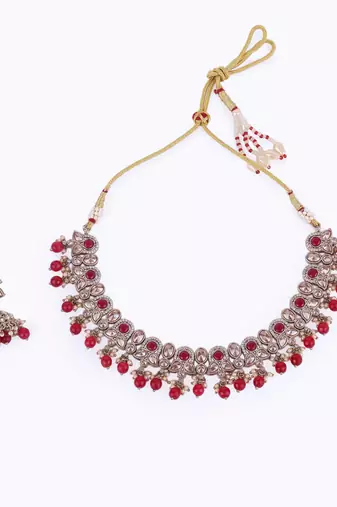 Trendy leaf and paisley design red stone gold plated choker necklace set with maangikka for women and girls