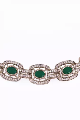 Flowing round shape cz studded gold plated green stone choker necklace set with maangikka for women and girls
