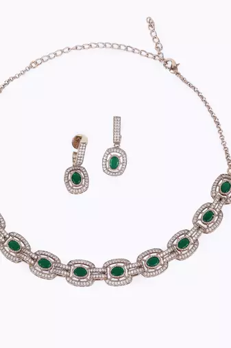 Flowing round shape cz studded gold plated green stone choker necklace set with maangikka for women and girls