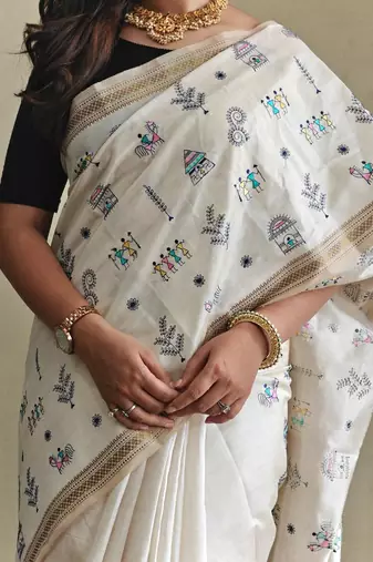 WHITE LOOM TUSSAR SAREE WITH ALL OVER WORLI EMBROIDERY PATTERN