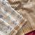 WHITE LOOM TUSSAR SAREE WITH ALL OVER WORLI EMBROIDERY PATTERN