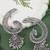 Silver plated oxidised peacock ear cuff with jhumka detailing for women 