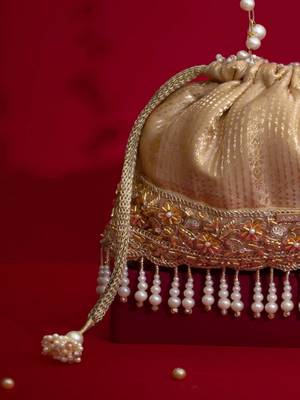 Beige embroidered  silk potli bag 1
