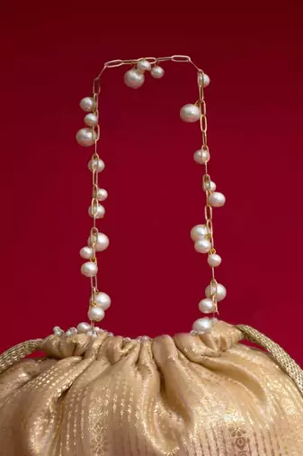 Beige embroidered  silk potli bag