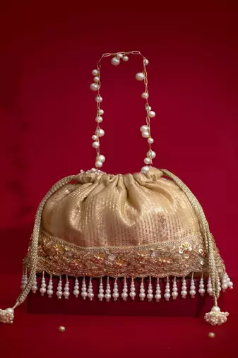 Beige embroidered  silk potli bag