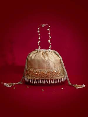 Beige embroidered  silk potli bag 1