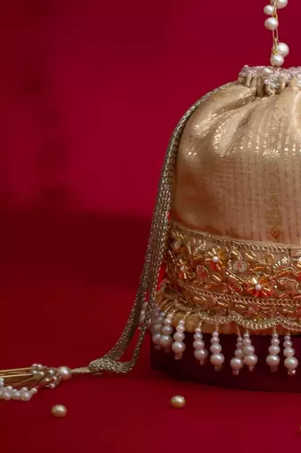 Beige embroidered  silk potli bag