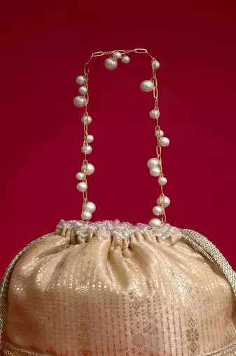 Beige embroidered  silk potli bag