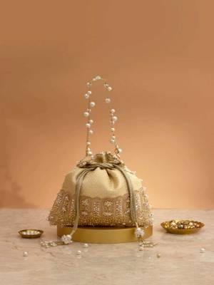 Cream embroidered  silk potli bag 1