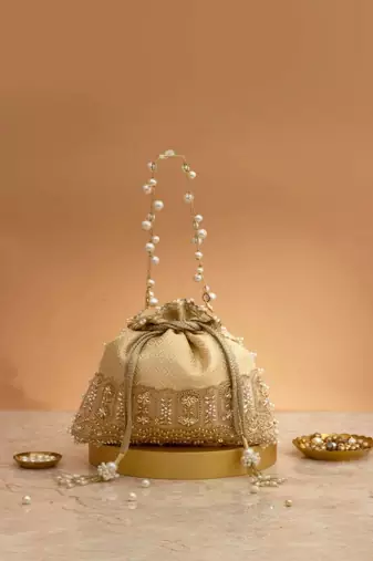 Cream embroidered  silk potli bag