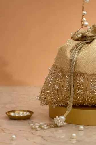 Cream embroidered  silk potli bag