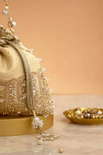 Cream embroidered  silk potli bag