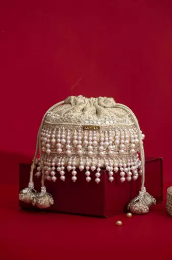 Ivory pearl embroidered  silk potli bag