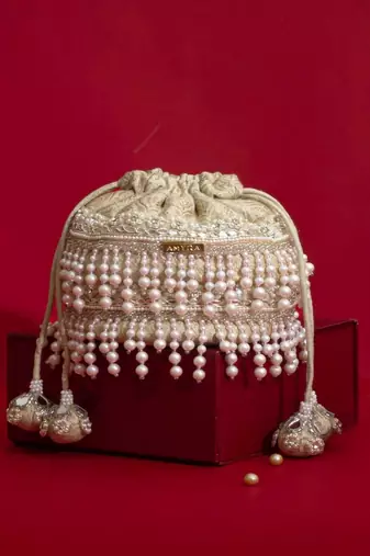 Ivory pearl embroidered  silk potli bag