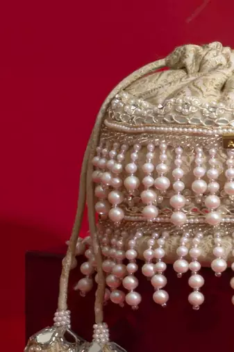 Ivory pearl embroidered  silk potli bag