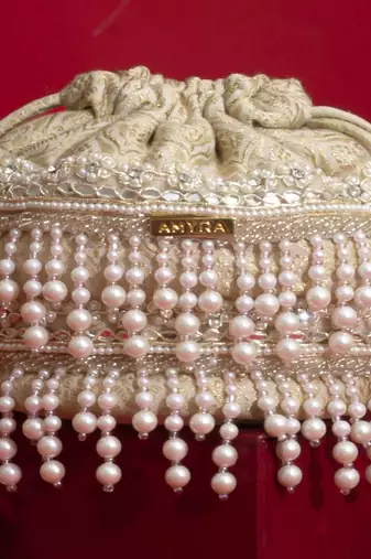 Ivory pearl embroidered  silk potli bag