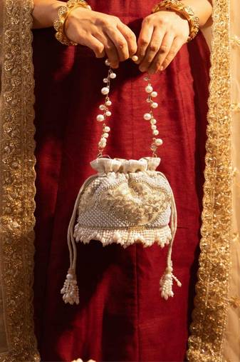 Beige embroidered  silk potli bag