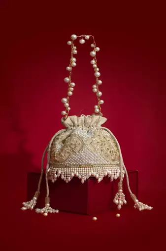 Beige embroidered  silk potli bag
