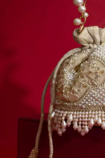 Beige embroidered  silk potli bag