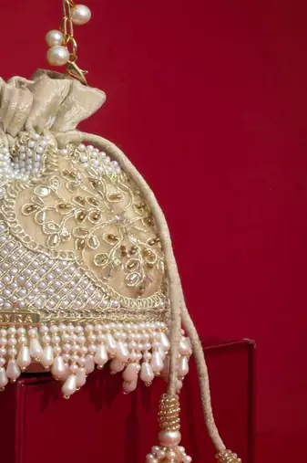 Beige embroidered  silk potli bag