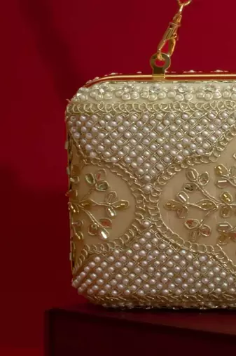 Beige floral embroidered silk clutch