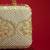 Beige floral embroidered silk clutch