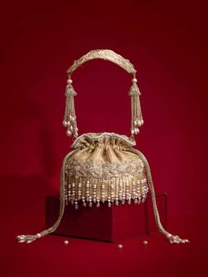 Beige embroidered  silk potli bag 1