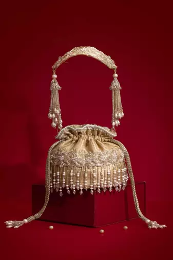 Beige embroidered  silk potli bag