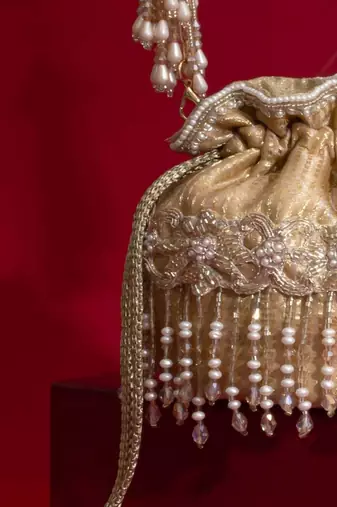 Beige embroidered  silk potli bag