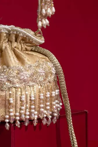 Beige embroidered  silk potli bag