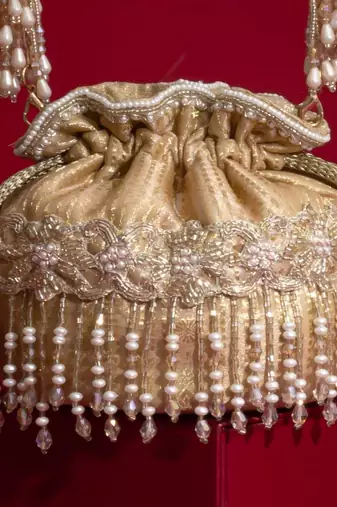 Beige embroidered  silk potli bag