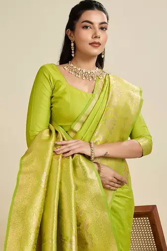 Light green color zari woven kanjivaram silk blend saree with blouse