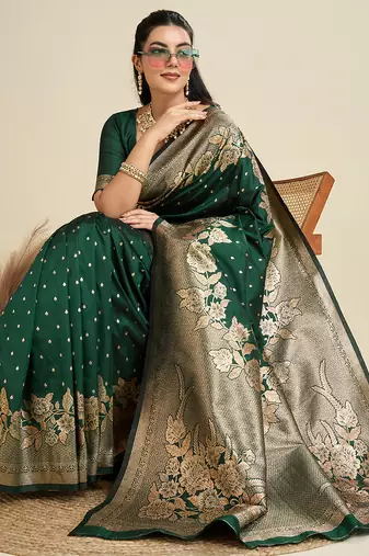 Green color zari woven kanjivaram silk blend saree with blouse