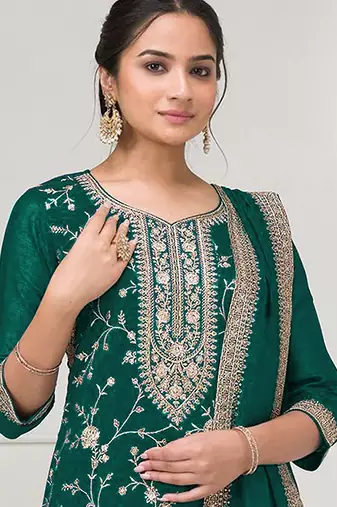 Dark green embroidered faux chiffon salwar suit
