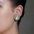 Gold plated kundan green stone stud earrings