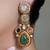 Gold plated kundan multicolor earrings