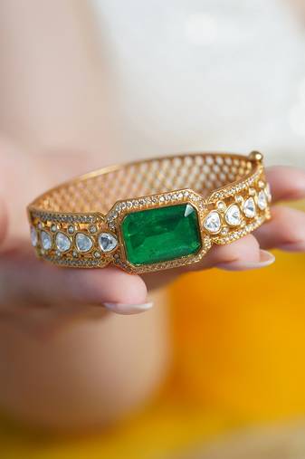 Gold plated kundan green stone bangle